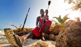 Maasai by the ocean on the beach. Kenya